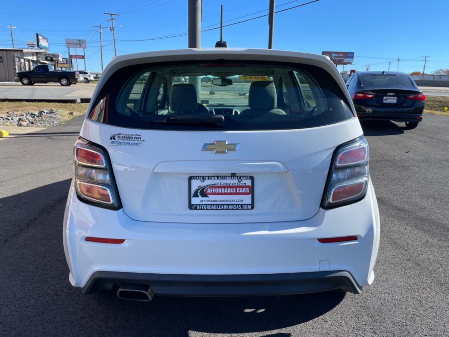 2017 White Chevrolet Sonic (1G1JG6SH2H4) with an 4-Cyl, 1.8 Liter engine, Automatic, 6-Spd transmission, located at 8008 Warden Rd, Sherwood, AR, 72120, (501) 801-6100, 34.830078, -92.186684 - Photo#6